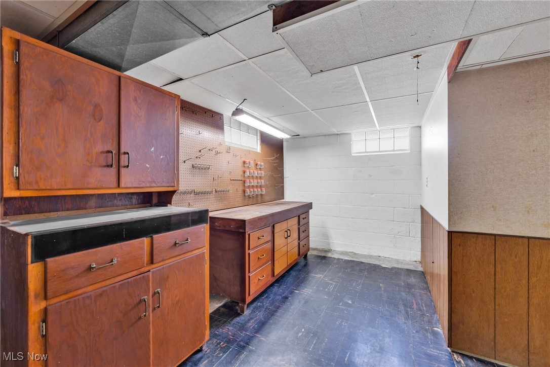 390 Hilliard Road Elyria, OH 44035 - Photo 24 of 30 Basement with dark floors and a drop ceiling