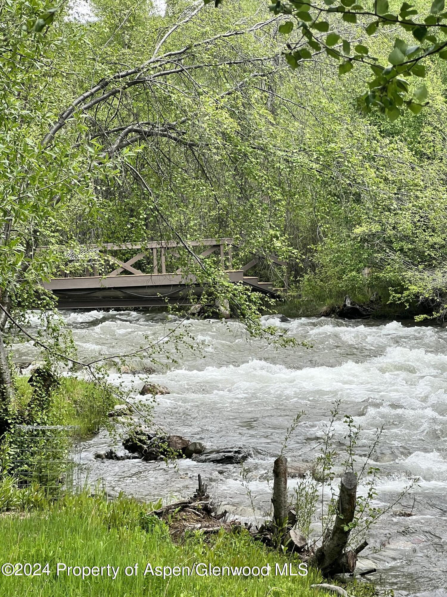 2005 Watson Divide Road Snowmass, CO 81654 - Photo 44 of 56 Snowmass Creek with Private Bridge
