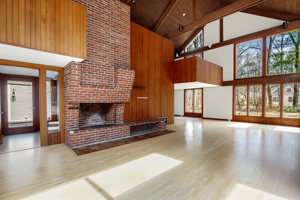 211 Pope Road Acton, MA 01742 - Photo 1 of 29 a view of an empty room with glass door and wooden floor
