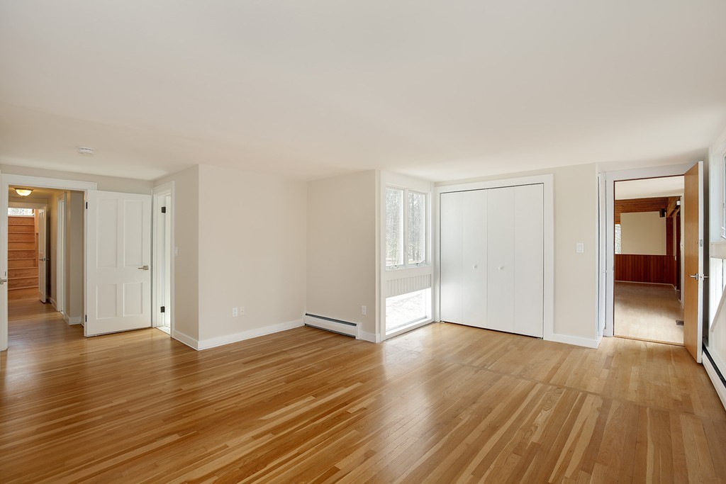 211 Pope Road Acton, MA 01742 - Photo 14 of 29 a view of an empty room with wooden floor