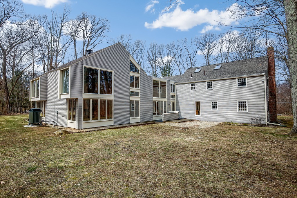 211 Pope Road Acton, MA 01742 - Photo 22 of 29 a front view of a house with a yard