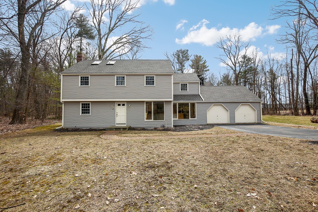 211 Pope Road Acton, MA 01742 - Photo 23 of 29 a house that has a tree in front of it