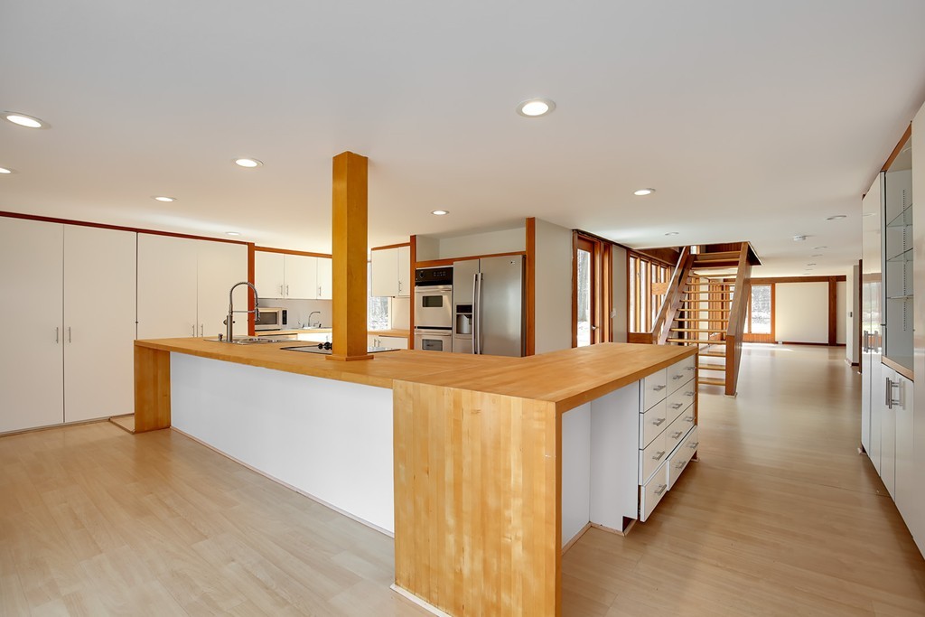 211 Pope Road Acton, MA 01742 - Photo 6 of 29 a kitchen with stainless steel appliances kitchen island sink refrigerator and stove