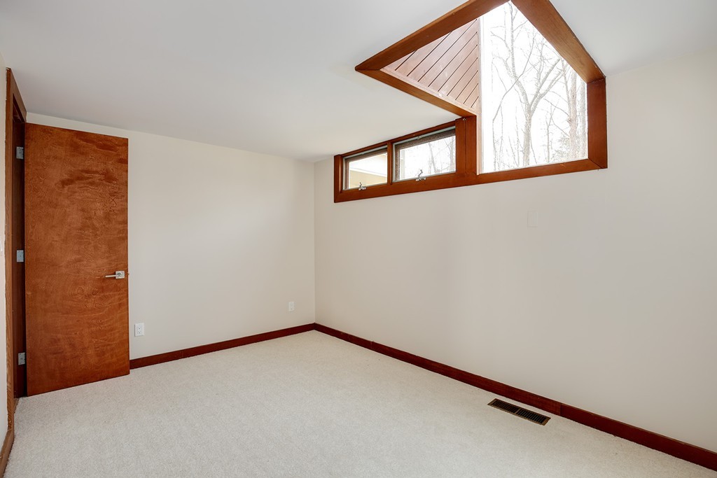 211 Pope Road Acton, MA 01742 - Photo 9 of 29 a view of an empty room with windows