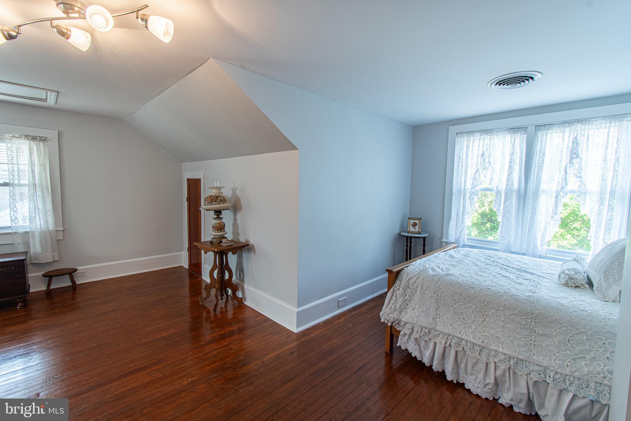 207 Crusader Road Cambridge, MD 21613 - Photo 47 of 76 a bedroom with a bed and a table