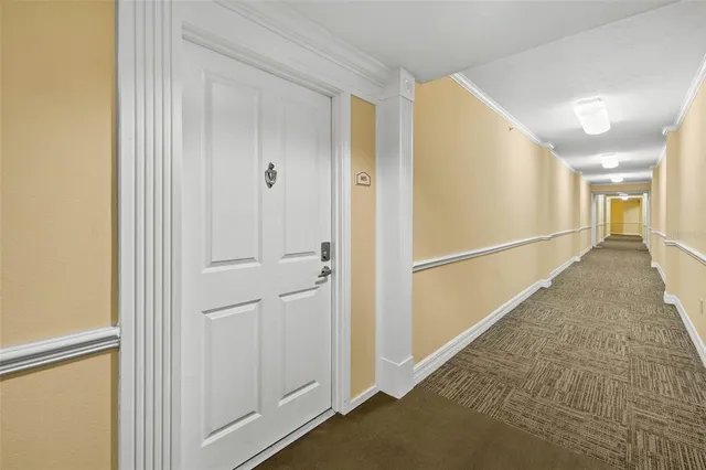 a dining room with furniture a chandelier and wooden floor