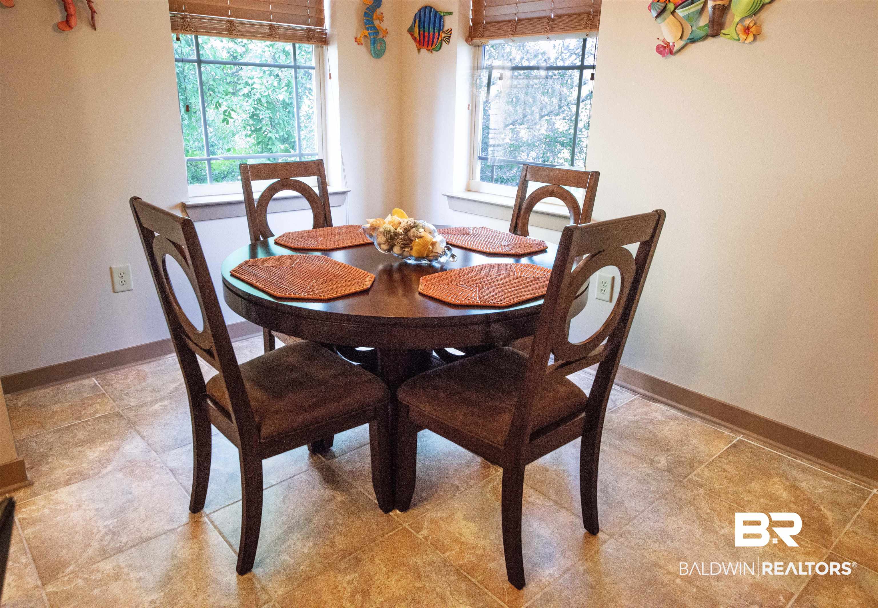 1430 Regency Road, Unit 301C Gulf Shores, AL 36542 - Photo 16 of 22 Tiled dining area with a wealth of natural light
