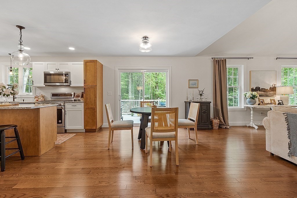 83 Russell Hill Road Brookline, NH 03033 - Photo 11 of 42 a living room with stainless steel appliances furniture a dining table and kitchen view