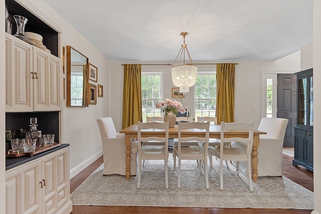 83 Russell Hill Road Brookline, NH 03033 - Photo 16 of 42 a view of a dining room with furniture window and wooden floor