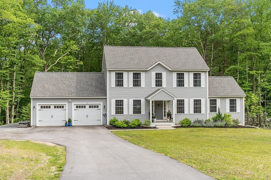 83 Russell Hill Road Brookline, NH 03033 - Photo 2 of 42 front view of a house with a yard