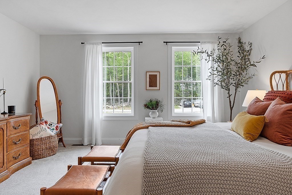 83 Russell Hill Road Brookline, NH 03033 - Photo 23 of 42 a bedroom with a bed and a large window