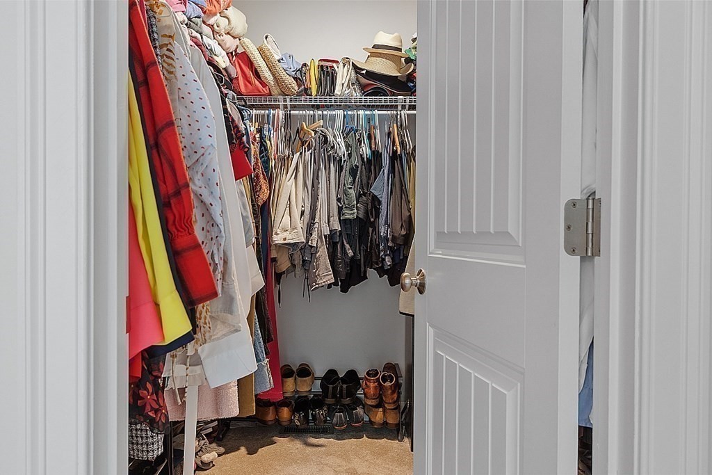 83 Russell Hill Road Brookline, NH 03033 - Photo 26 of 42 a view of walk in closet with clothes