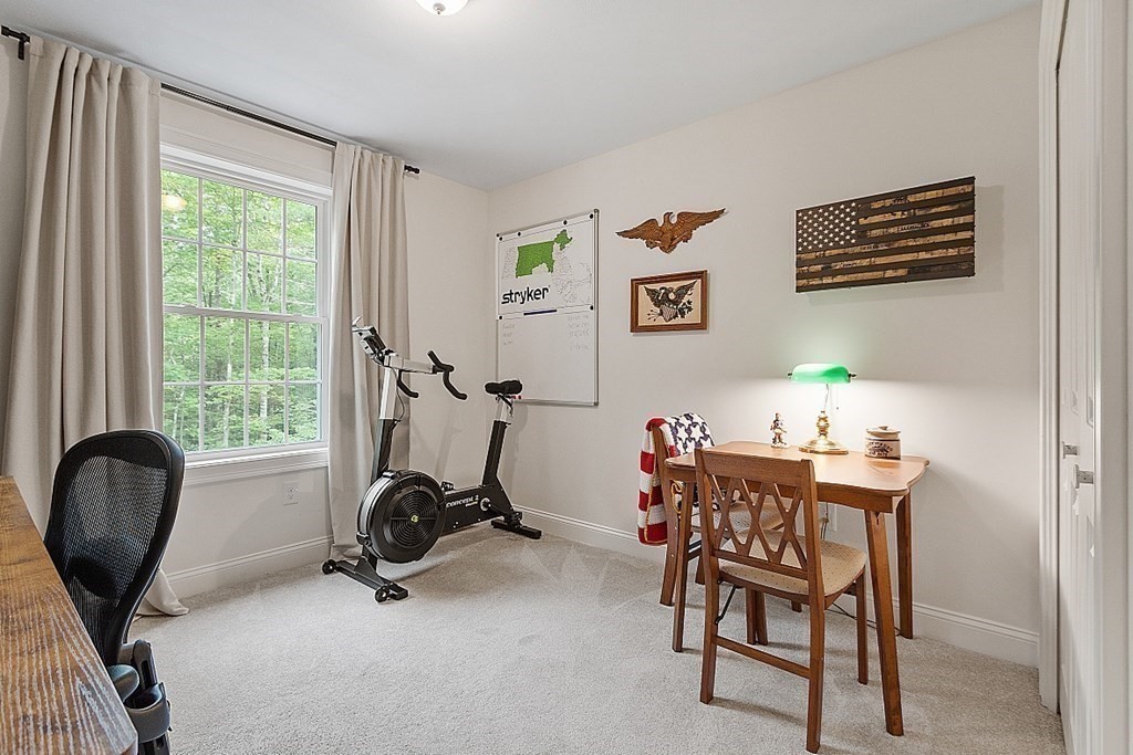 83 Russell Hill Road Brookline, NH 03033 - Photo 31 of 42 a view of a workspace with furniture and a window