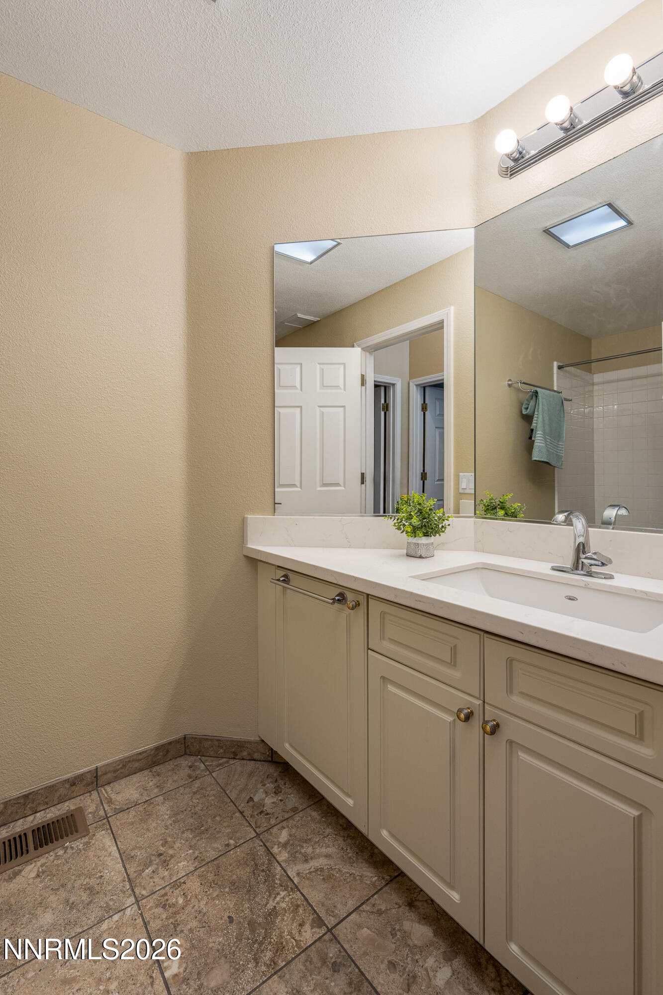 1840 Hunter Creek Road Reno, NV 89519 - Photo 23 of 39 a bathroom with a sink and a mirror
