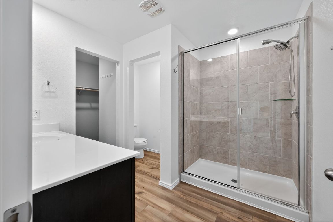 596 Wyatt Way Jarrell, TX 76537 - Photo 12 of 21 a bathroom with a shower and sink