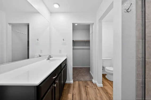 a bathroom with a shower and sink