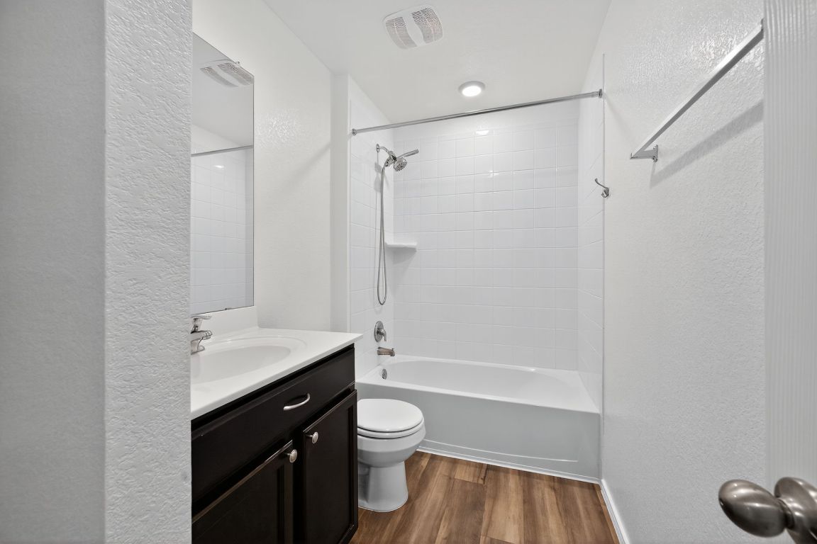 596 Wyatt Way Jarrell, TX 76537 - Photo 14 of 21 a bathroom with a sink a toilet and a shower