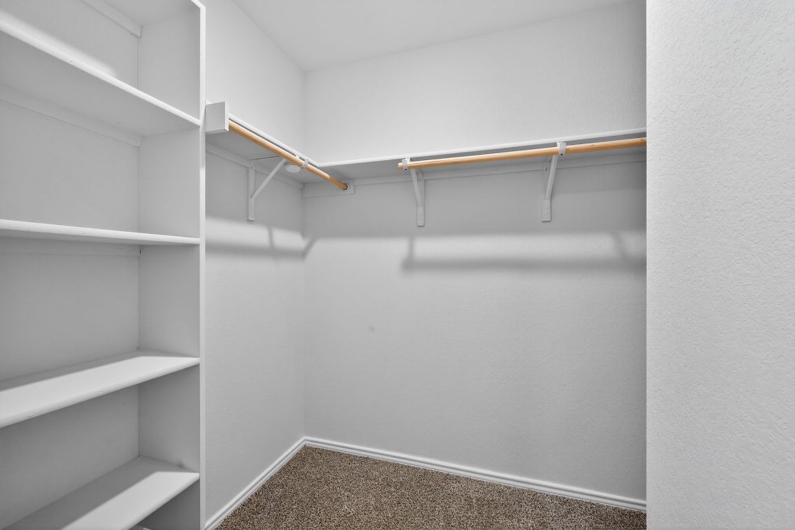 596 Wyatt Way Jarrell, TX 76537 - Photo 15 of 21 a view of an empty walk in closet