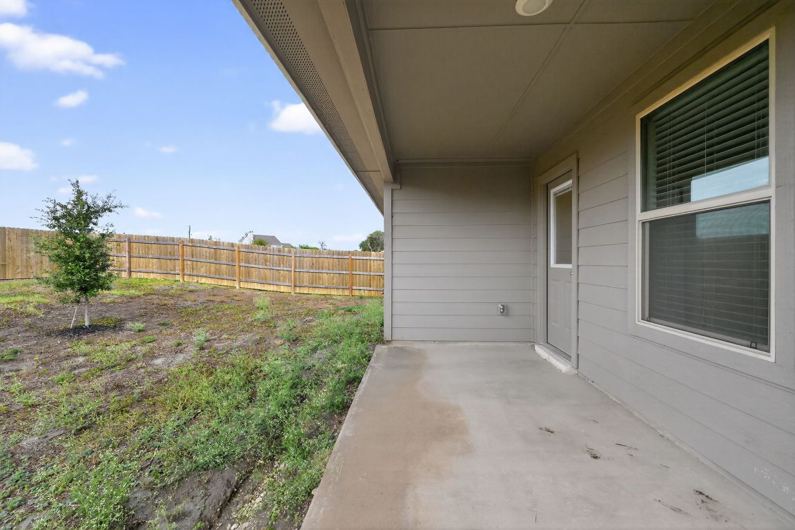 596 Wyatt Way Jarrell, TX 76537 - Photo 17 of 21 a view of a big room with wooden fence