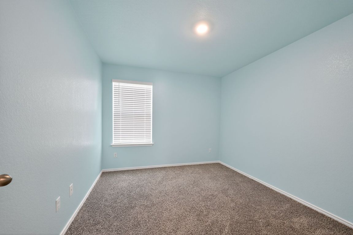 596 Wyatt Way Jarrell, TX 76537 - Photo 4 of 21 an empty room with a window