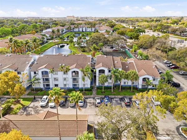 an aerial view of a house with a ocean view