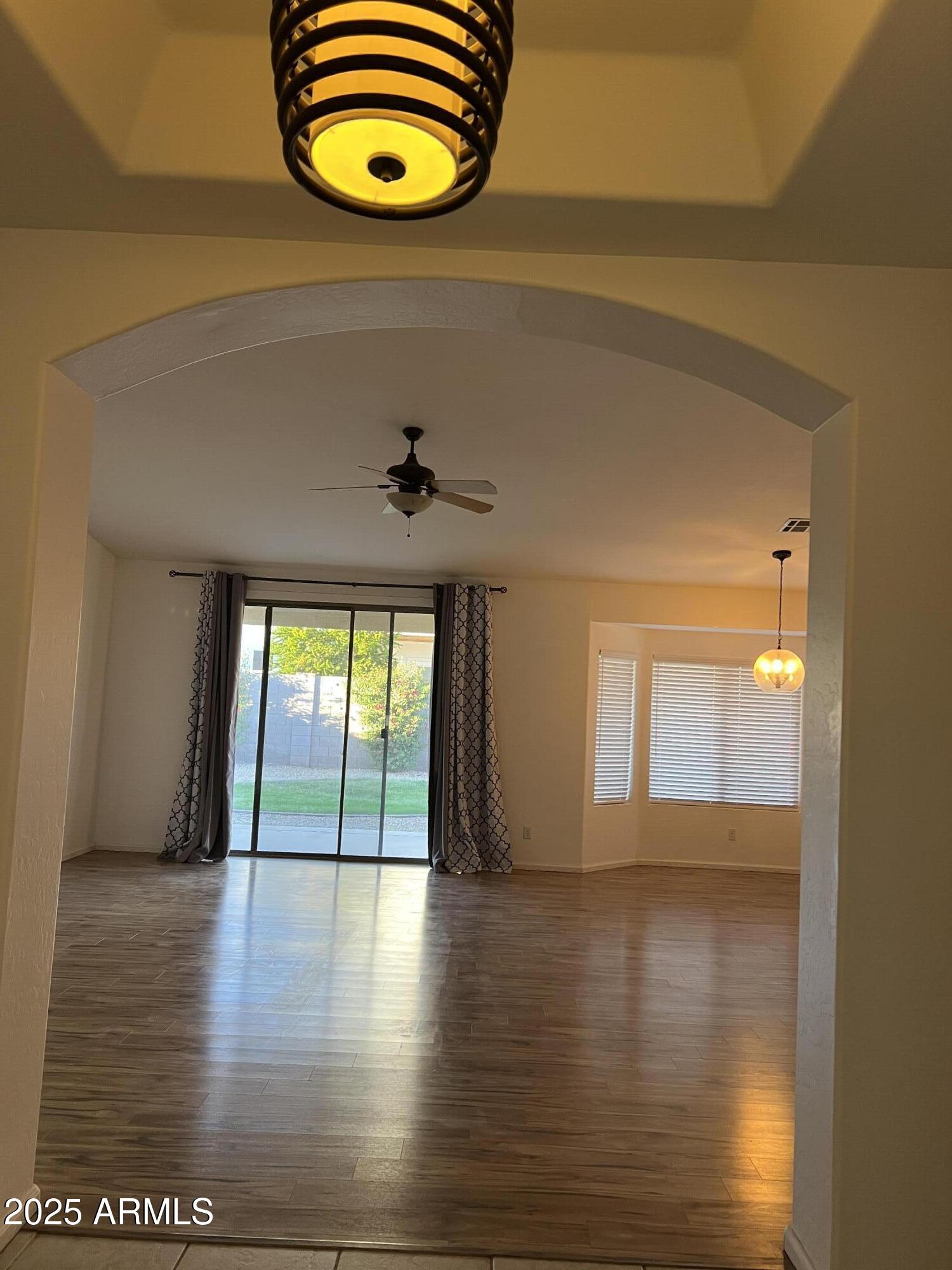 4484 East Redfield Court Gilbert, AZ 85234 - Photo 12 of 25 a view of a room has wooden floor and window