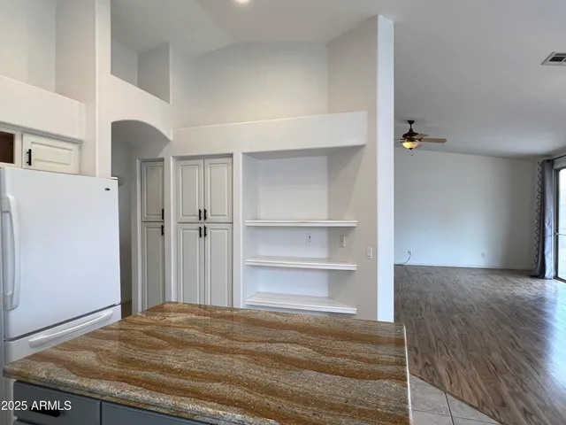 a view of a room with wooden floor and closet