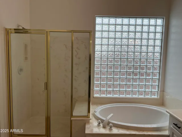 a bath tub sitting next to a window