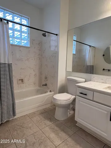 a bathroom with a toilet sink and shower