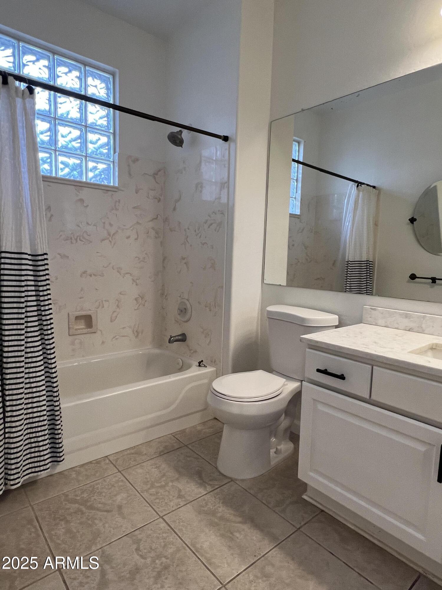 4484 East Redfield Court Gilbert, AZ 85234 - Photo 22 of 25 a bathroom with a toilet sink and shower