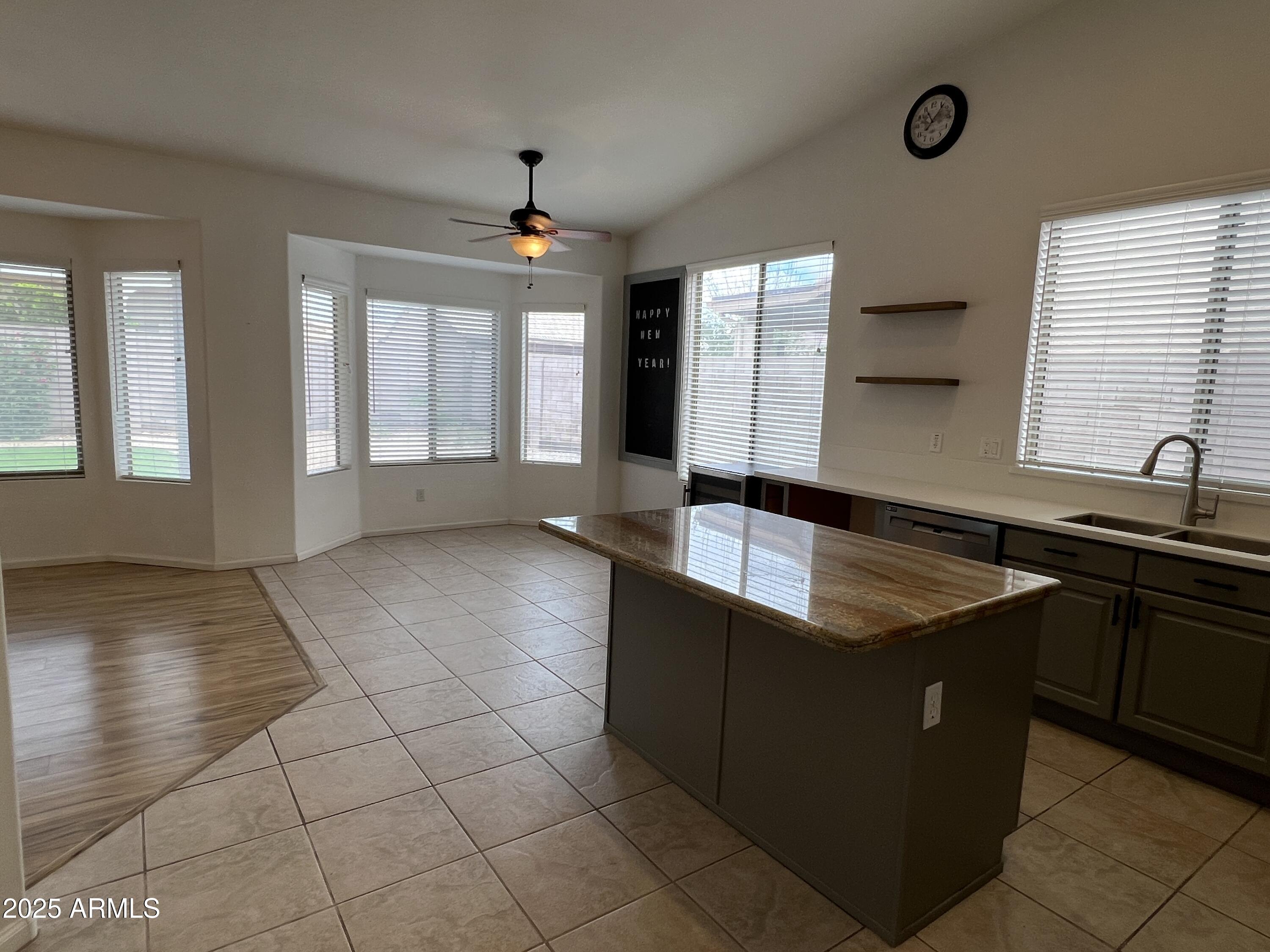 4484 East Redfield Court Gilbert, AZ 85234 - Photo 5 of 25 a view of a kitchen with granite countertop a sink and a stove