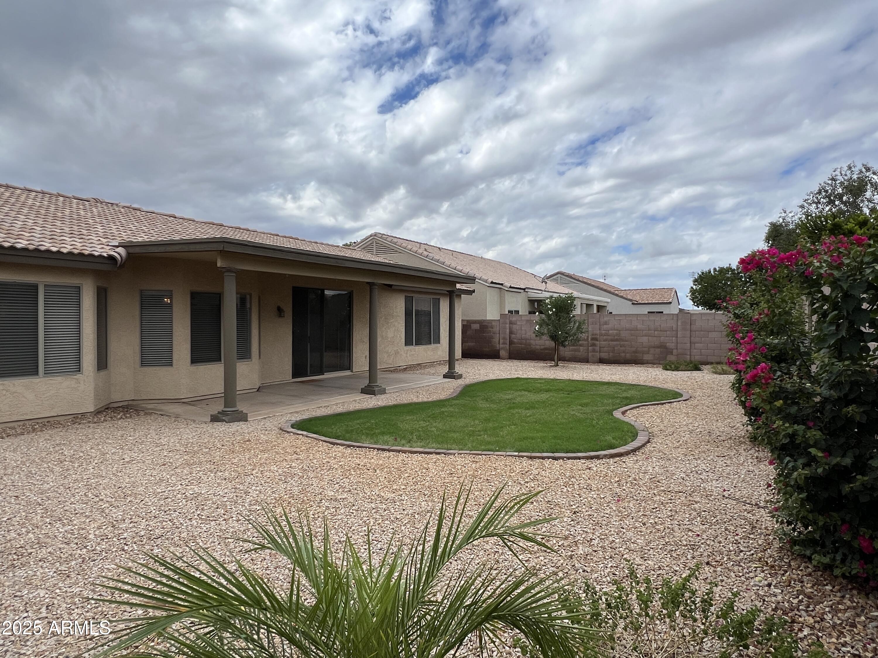 4484 East Redfield Court Gilbert, AZ 85234 - Photo 6 of 25 a front view of a house with a garden