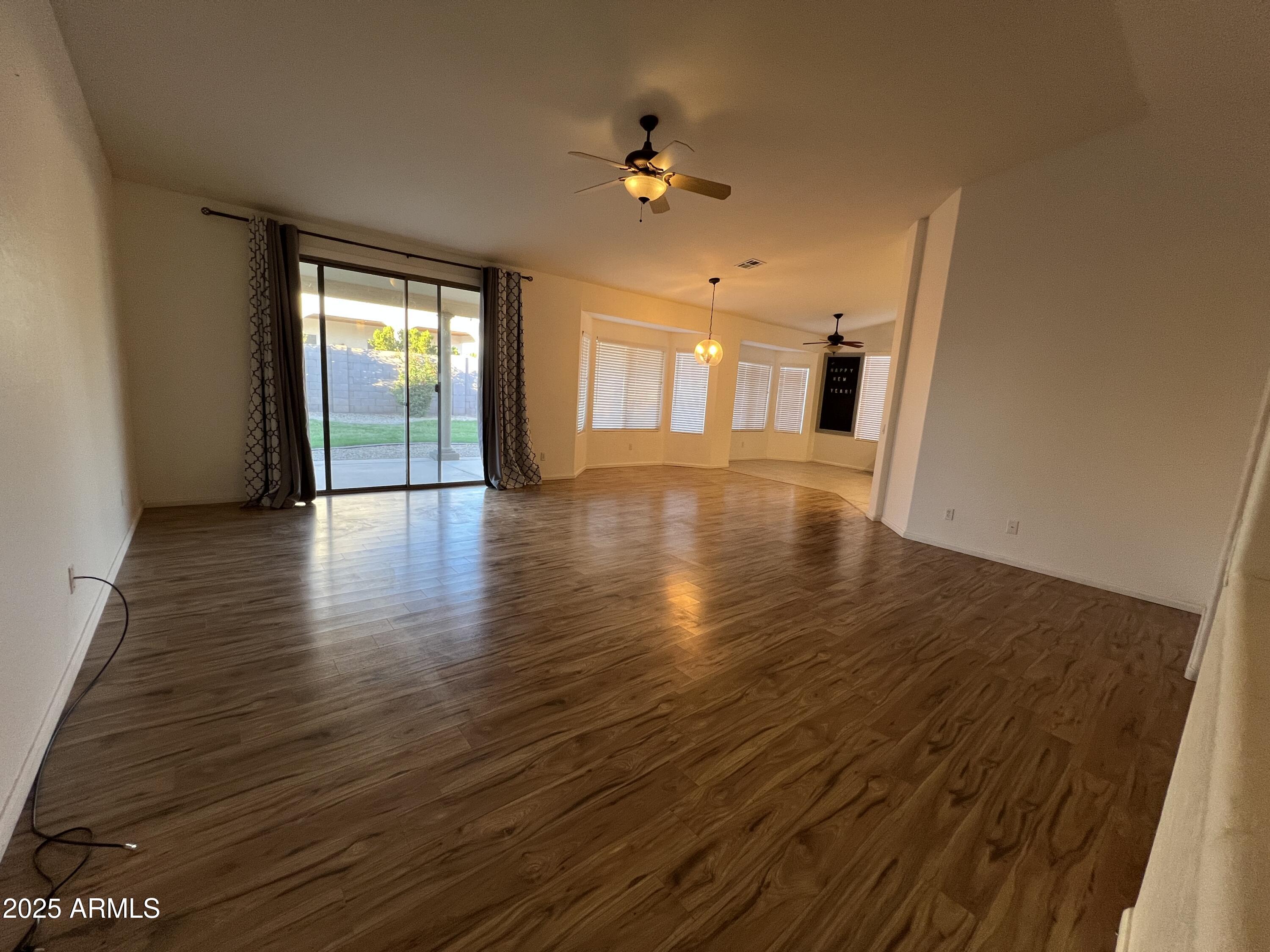 4484 East Redfield Court Gilbert, AZ 85234 - Photo 10 of 25 wooden floor in an empty room with a window