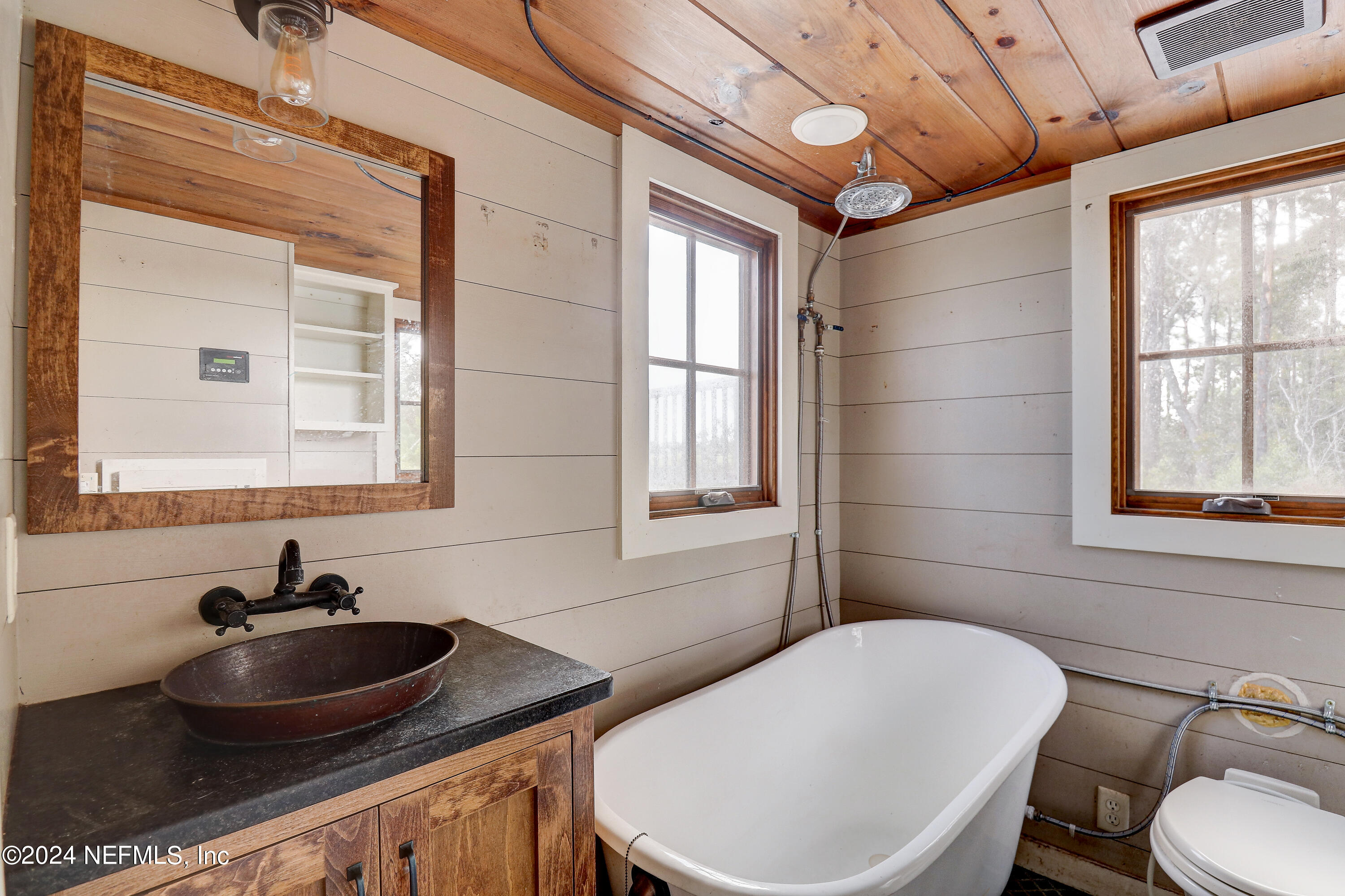 15649 Shellcracker Road Jacksonville, FL 32226 - Photo 18 of 35 a bathroom with a toilet sink and mirror