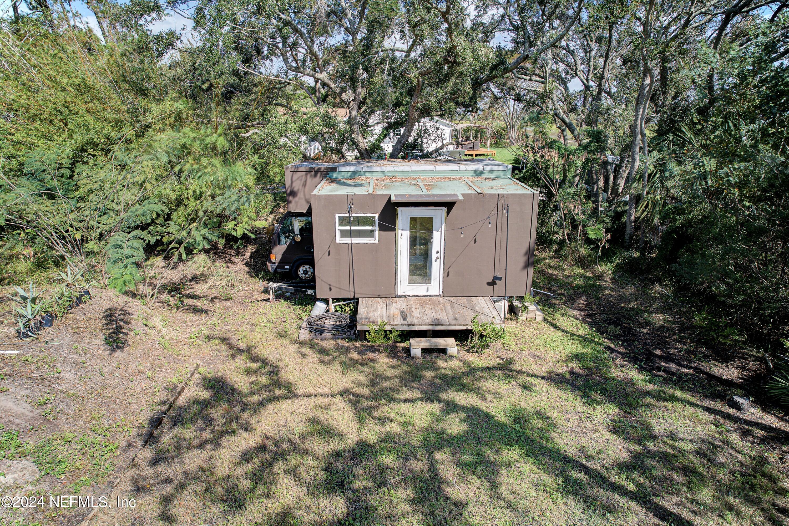 15649 Shellcracker Road Jacksonville, FL 32226 - Photo 25 of 35 a view of a barn in the middle of a yard