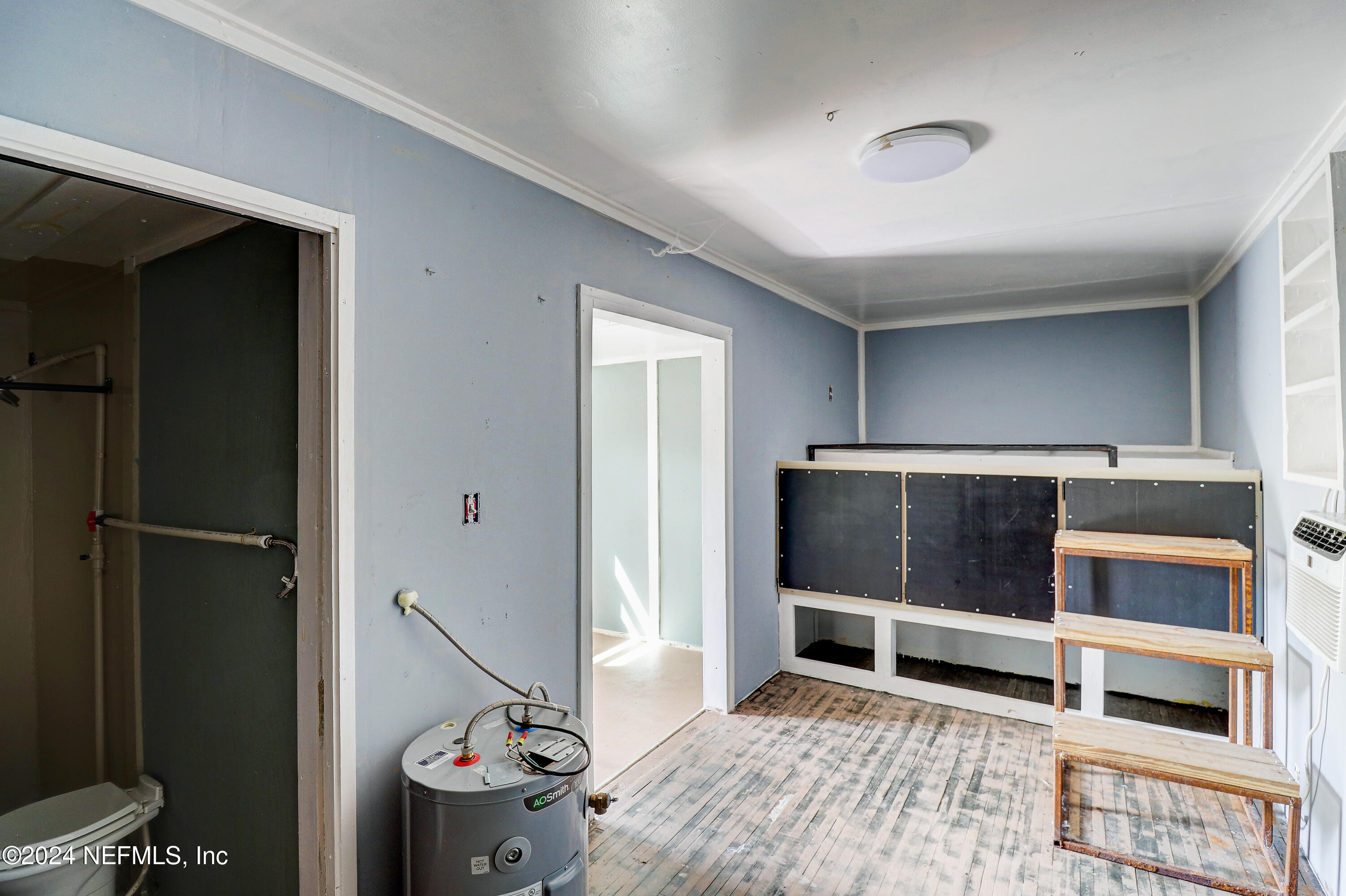 15649 Shellcracker Road Jacksonville, FL 32226 - Photo 28 of 35 a bedroom with bed and cabinets