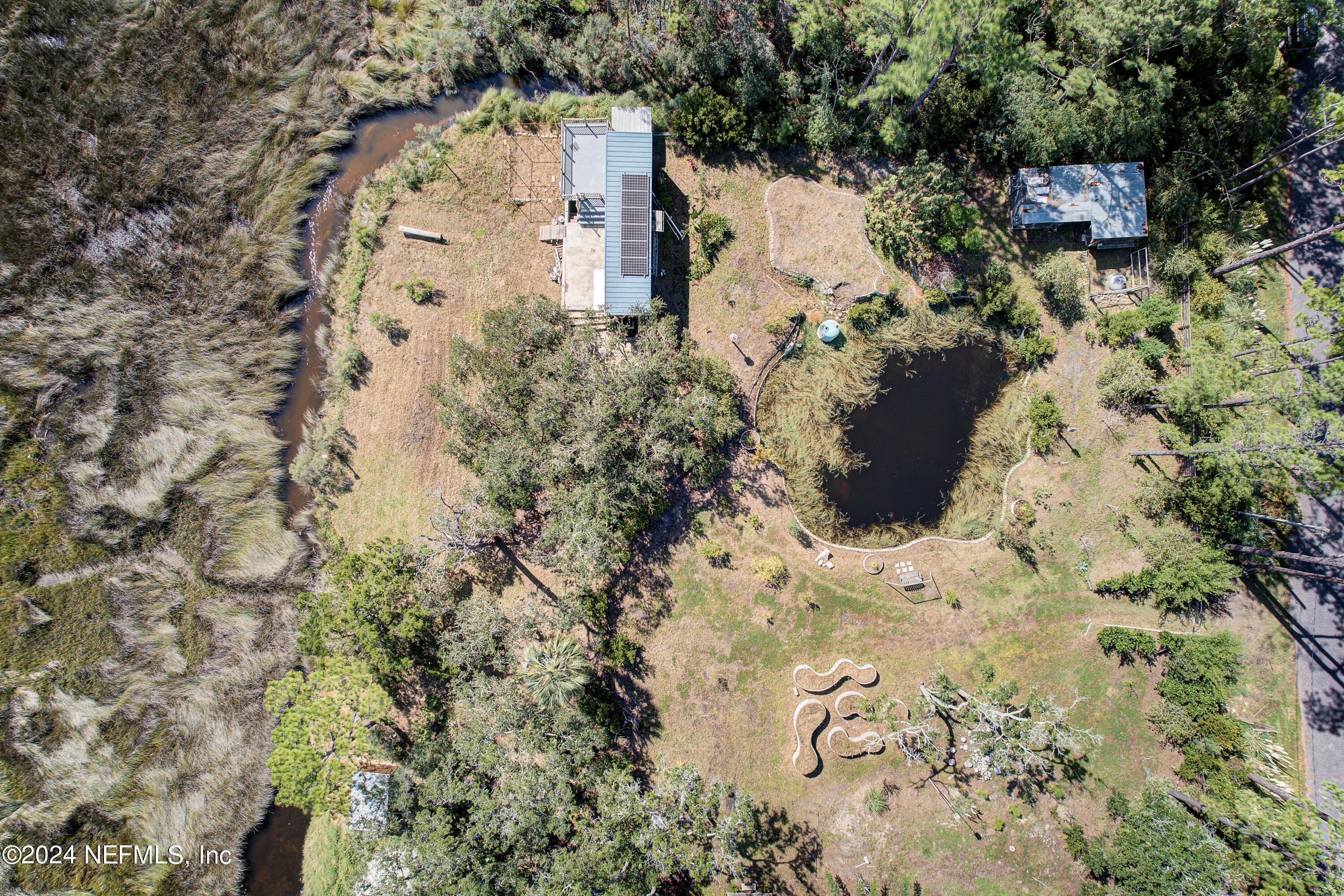 15649 Shellcracker Road Jacksonville, FL 32226 - Photo 32 of 35 an aerial view of a house with a yard