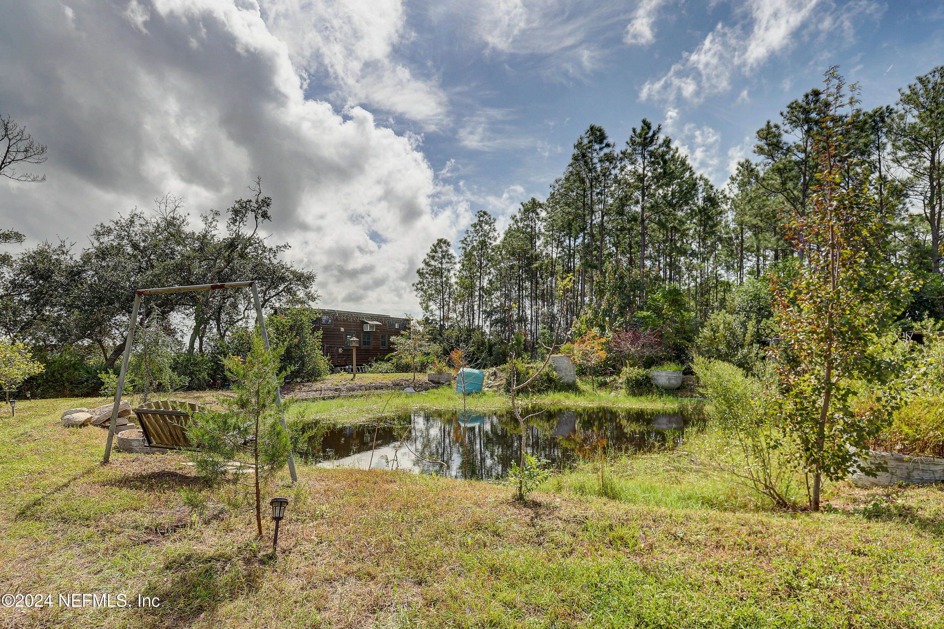 15649 Shellcracker Road Jacksonville, FL 32226 - Photo 10 of 35 a view of a yard with table and chairs