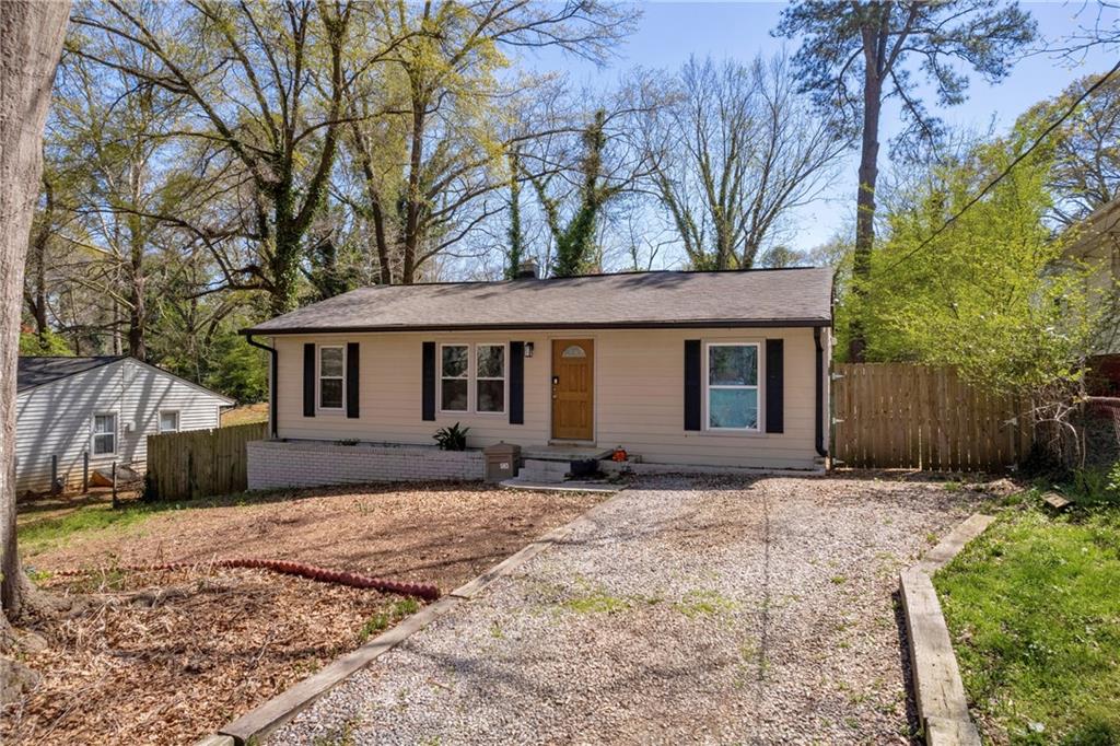 3351 Phillip Circle Decatur, GA 30032 - Photo 1 of 29 a front view of a house with a yard and shrubs