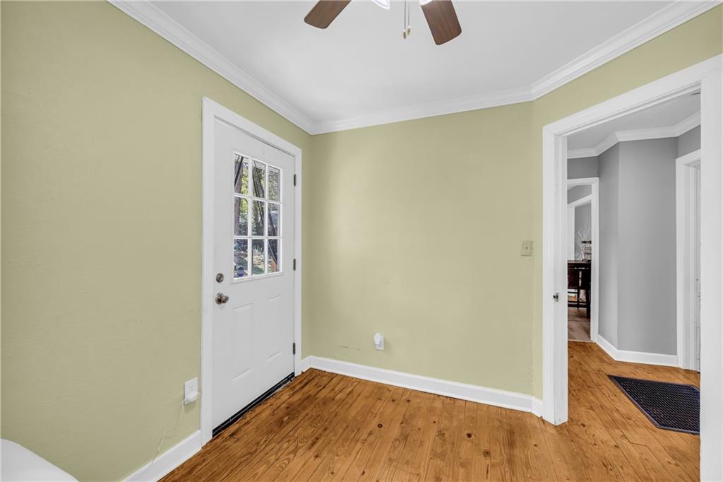 3351 Phillip Circle Decatur, GA 30032 - Photo 14 of 29 an empty room with wooden floor and windows