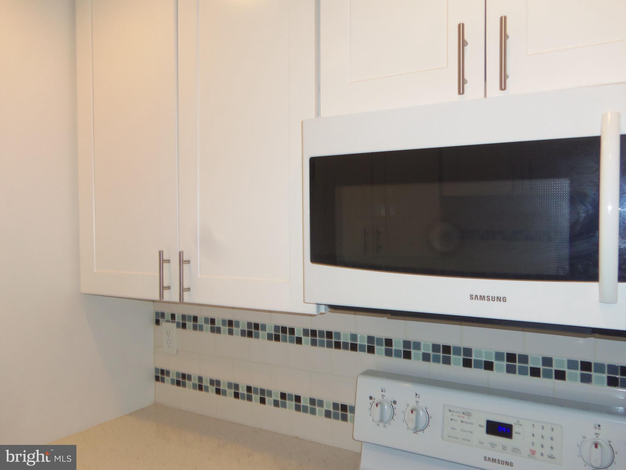 15217 Tottenham Terrace, Unit 27B Silver Spring, MD 20906 - Photo 9 of 46 Kitchen with gorgeous backsplash