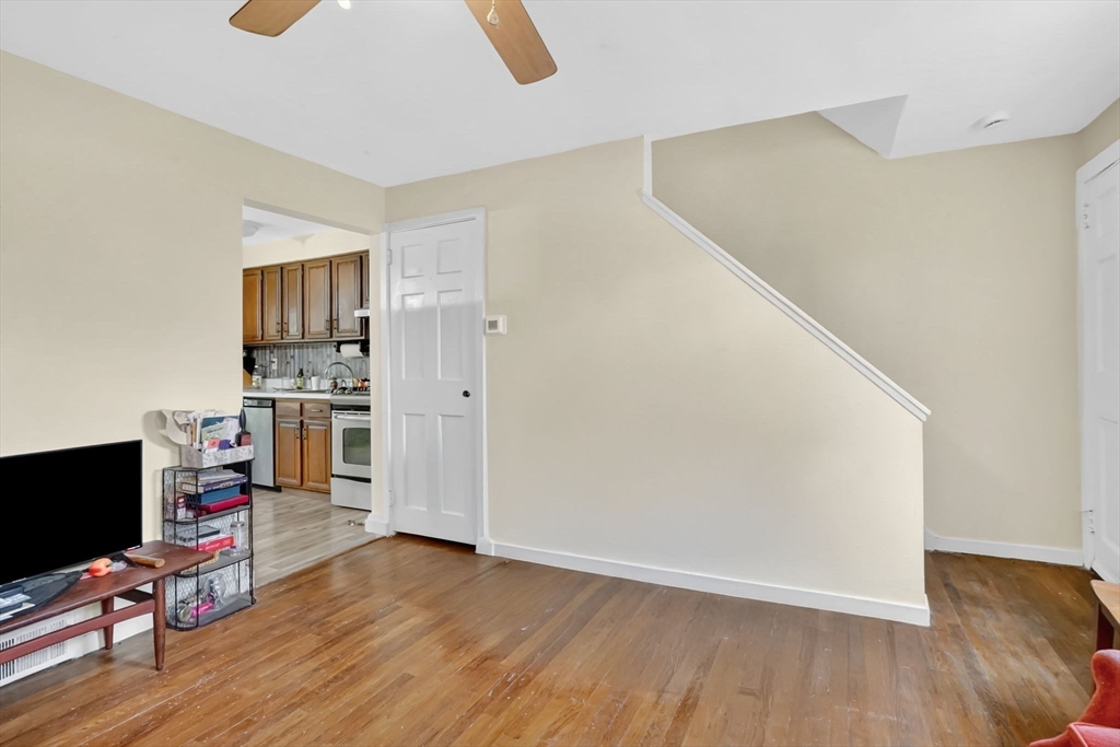 1440-1446 Carew Street Springfield, MA 01104 - Photo 15 of 26 a view of a workspace with furniture and wooden floor