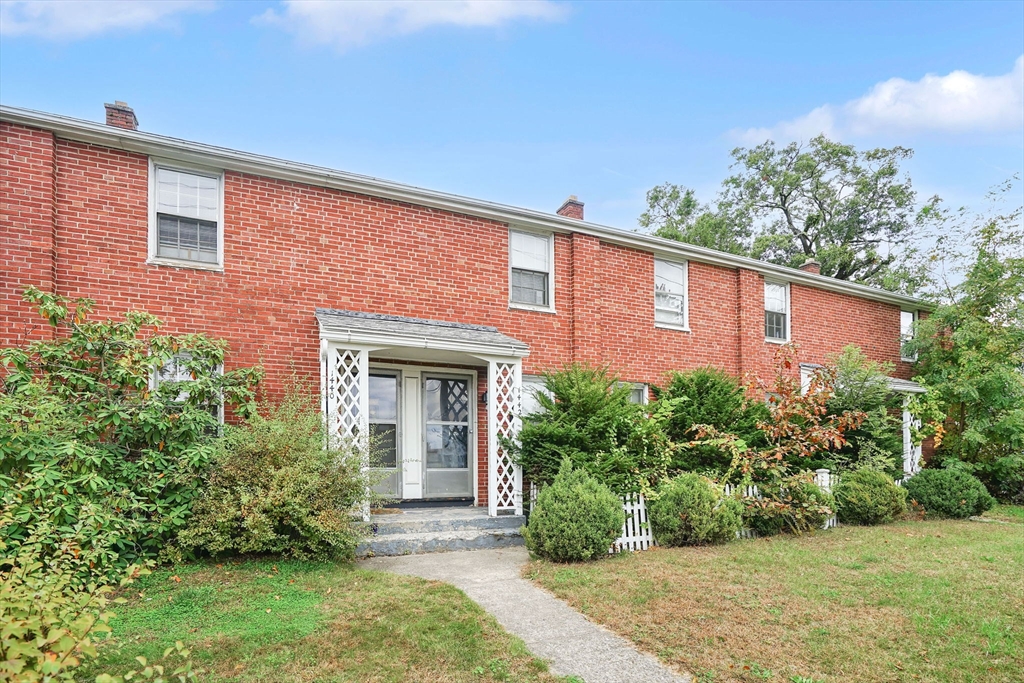 1440-1446 Carew Street Springfield, MA 01104 - Photo 2 of 26 a front view of a house with garden