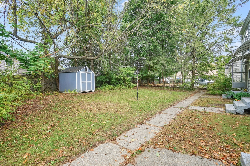 1440-1446 Carew Street Springfield, MA 01104 - Photo 3 of 26 a view of a backyard with a garden