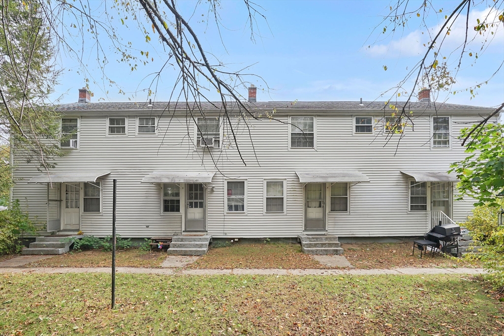 1440-1446 Carew Street Springfield, MA 01104 - Photo 4 of 26 front view of a house with a yard