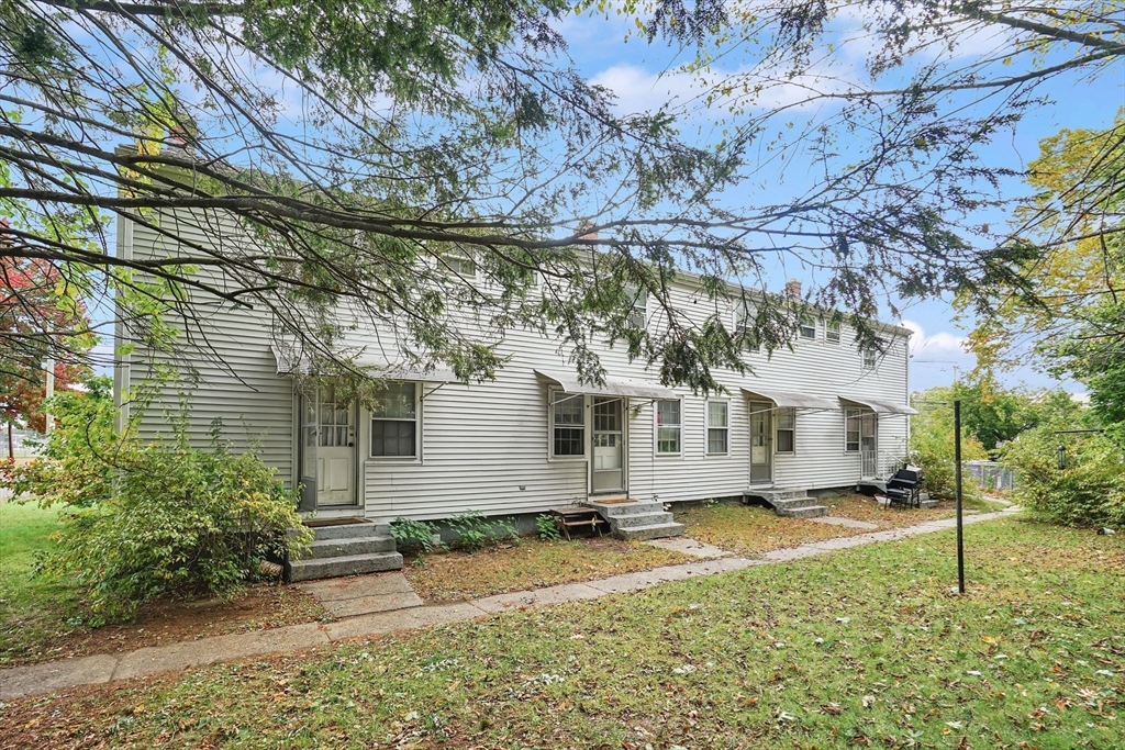 1440-1446 Carew Street Springfield, MA 01104 - Photo 5 of 26 front view of a house with a yard