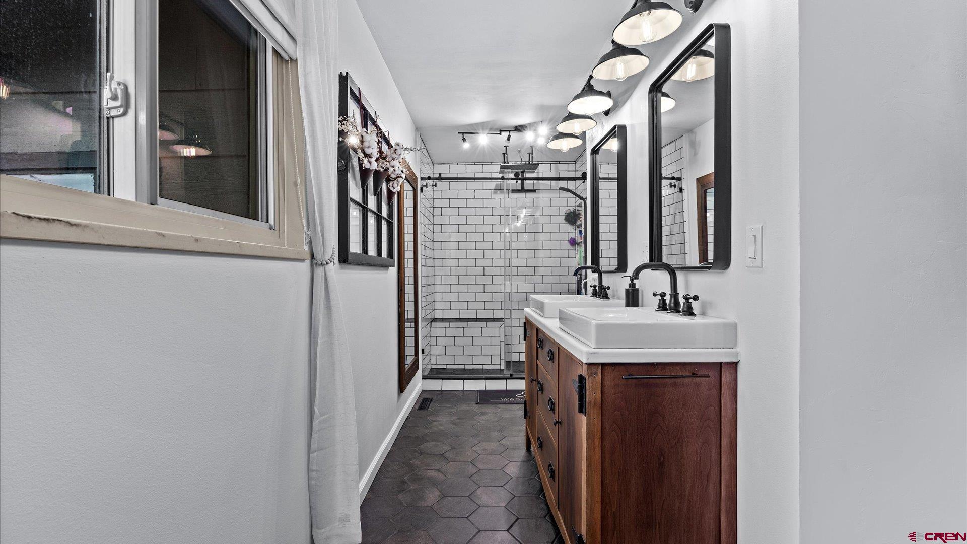 1761 G Road Delta, CO 81416 - Photo 10 of 43 a bathroom with a sink and a mirror