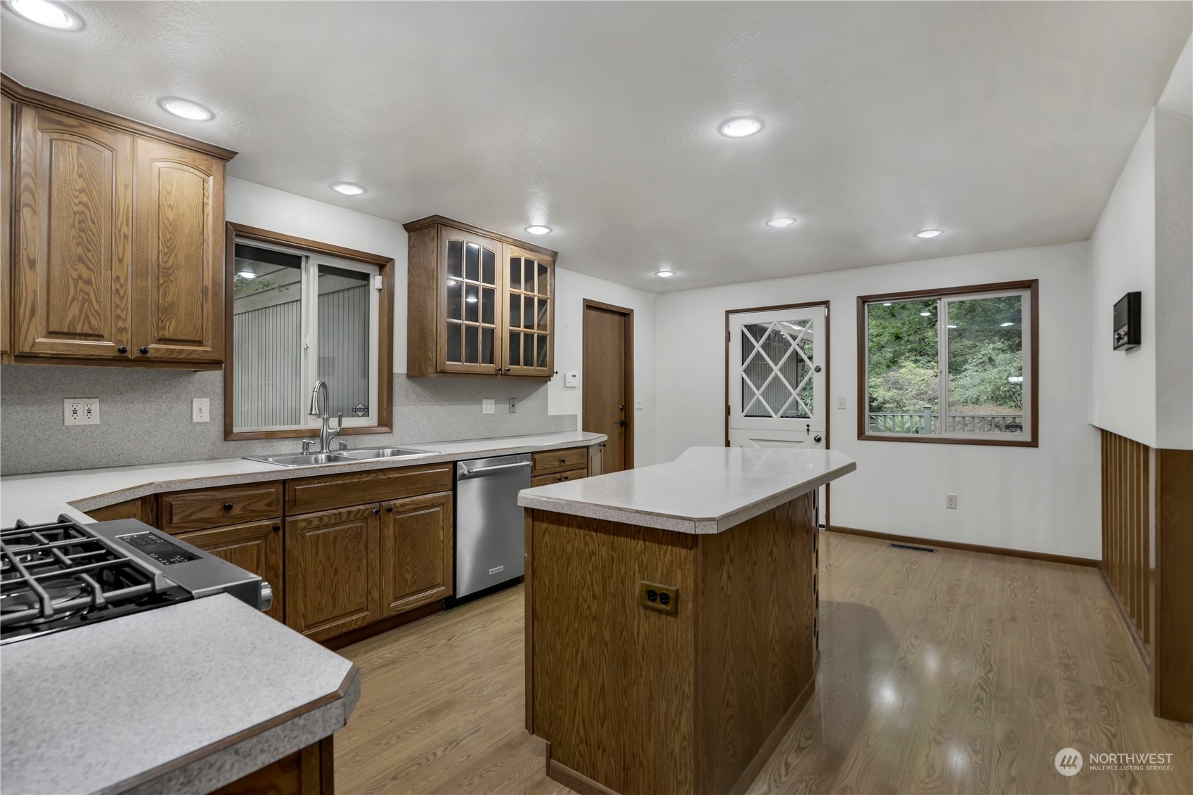 6120 Delphi Road Southwest Olympia, WA 98512 - Photo 11 of 40 a kitchen with stainless steel appliances a sink stove and cabinets