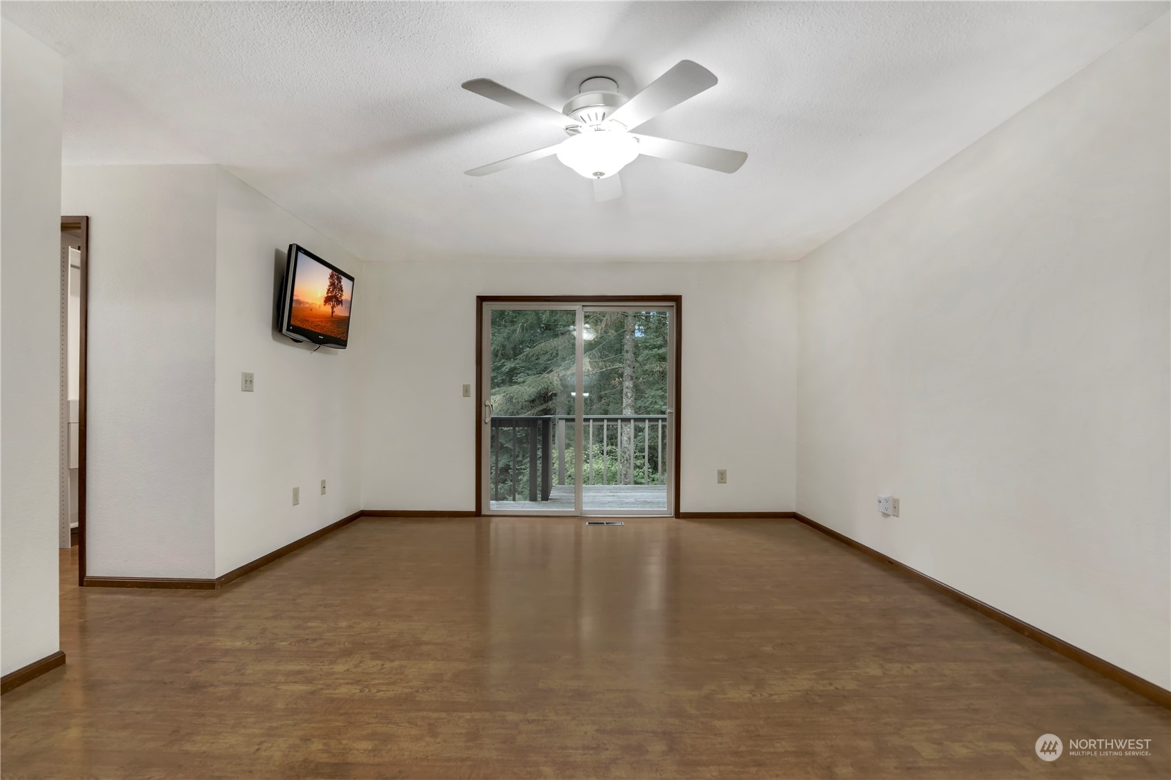 6120 Delphi Road Southwest Olympia, WA 98512 - Photo 16 of 40 an empty room with windows and ceiling fan