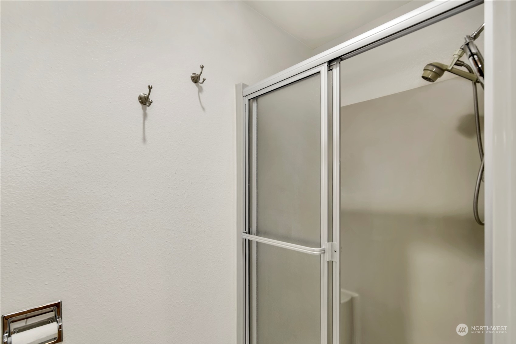 6120 Delphi Road Southwest Olympia, WA 98512 - Photo 18 of 40 a bathroom with a glass shower door
